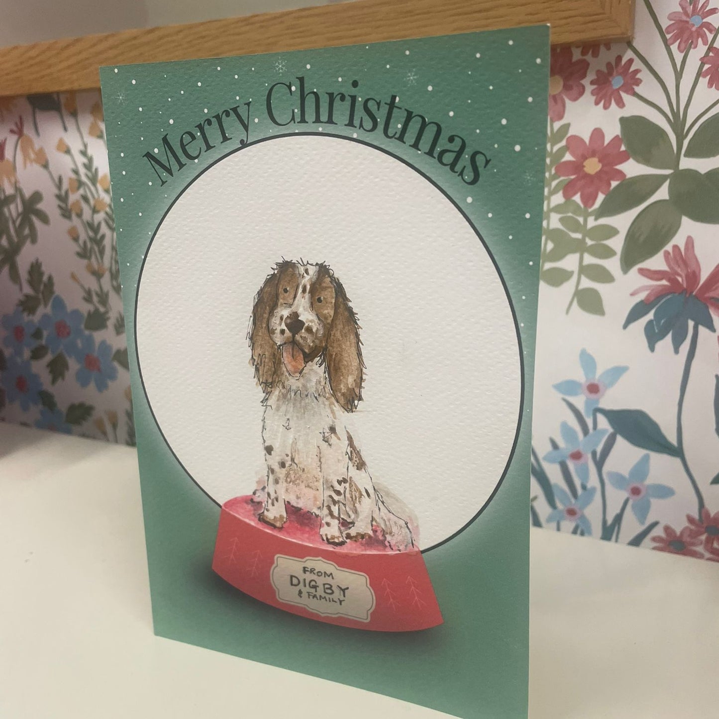 Christmas card with a dog illustration and 'Merry Christmas' with snow globe
